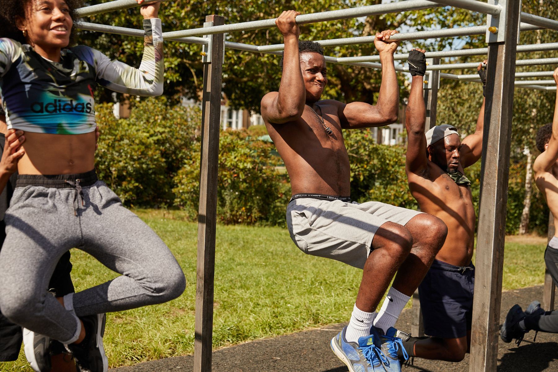People of all ages training together on the bars at a Steel Warriors gym